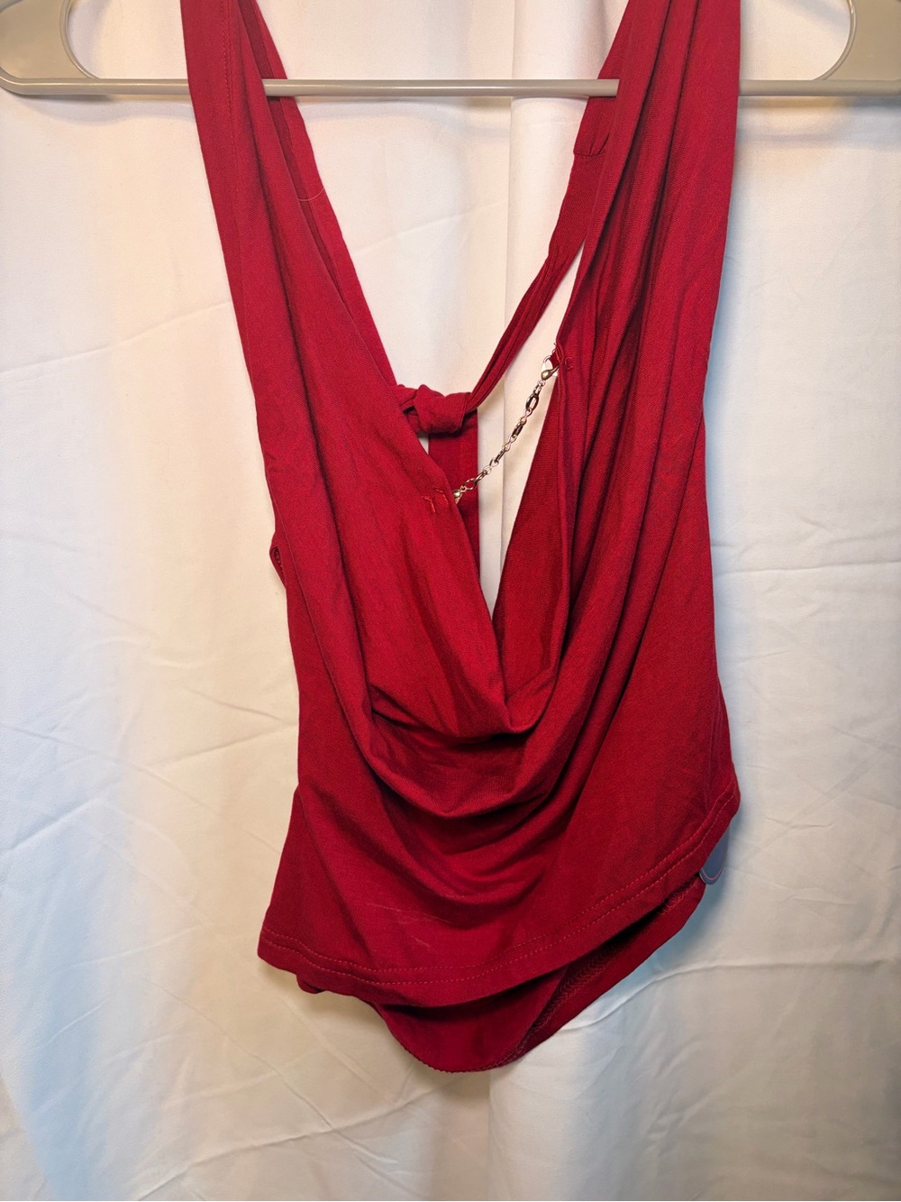 Red draped neck top with chain detail